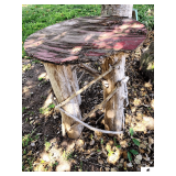 PRIMITIVE YARD TABLE W/ LEGS- POSSIBLY CEDAR- TOP NEEDS REPAIRING- PIECE OF DRIFTWOOD