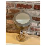 Lighted magnifying mirror