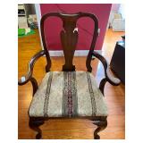 Wood and fabric padded captain chair