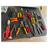 Large assortment of pliers, cutters, and snips