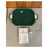 Green serving tray and white marble cheese slicer