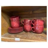 6 red mugs and saucers