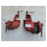 2 small clamp on vises