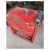 red rolling toolbox and contents