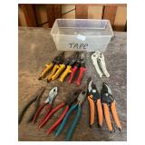 Plastic tote of assorted pliers