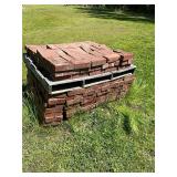 Pallet and half red bricks
