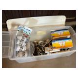 Plastic tote with assorted lightbulbs