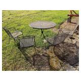 Wrought iron patio table and 4 chairs