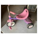 Radio, flyer, P!nk, and Purple tricycle