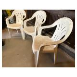 3 white plastic folding chairs