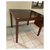 Tall square wooden table