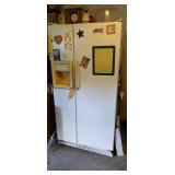 Side by Side Refrigerator and Contents on Top.