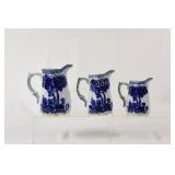 Flow Blue Three Creamer Jugs with Gold Highlights