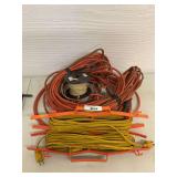 2 yellow Extension cords, orange heavy duty extension cord, partial spool of telephone station wire