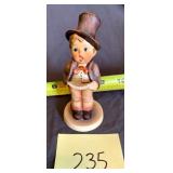 Hummel Singer in hat with sheet music