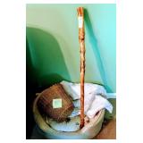 Wicker trash basket, dogbed, nice hiking stick