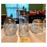 Pressed and etched glass lidded steins