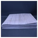 Stack of Wood Grain Laminate Sheets