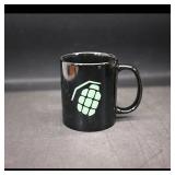 Black Ceramic Mug with Green Character Graphic
