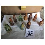 10 MINI CORK TOP BOTTLES,SOME EMBOSED W/ CORKS