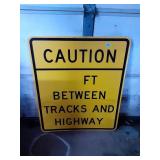 CAUTION BETEEN TRACKS AND HIGHWAY SIGN 36X36