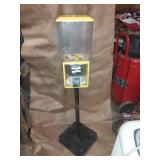 YELLOW VINTAGE GUMBALL MACHINE ON STAND