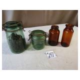 GREEN GLASS JARS W/ GLASS LIDS; 2 AMBER BOTTLES