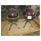 2- PURPLE GLASS GLOBES IN WROUGHT IRON STAND