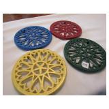 4 CAST IRON TRIVETS