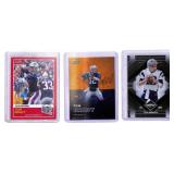 Three Tom Brady Numbered Football Cards