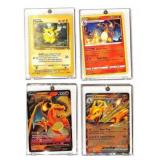 Four Pokemon Trading Cards in Cases