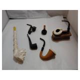 Six Smoking Pipes and a Holder