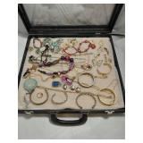 Mix of Assorted Jewelry in Black Display Case