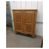 Wooden Cabinet With Carved Panels