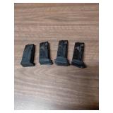 Four SIG 9mm Pistol Magazines