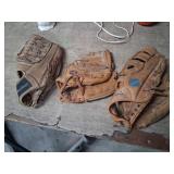 Three Baseball Gloves