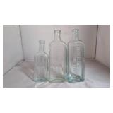 Three Glass Medicine Bottles