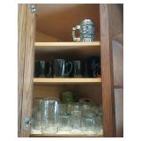 Cabinet Contents: Mugs, Glasses, Navy Stein