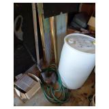 Weedeater, Garden Hose, and Plastic Barrel