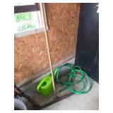 Garden Hose, Watering Can, and Hoe