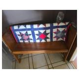 Wooden Bench with Patchwork Quilt
