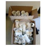 White PVC Pipe Fittings in Boxes