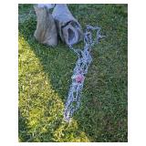 Two green bags of tire chains