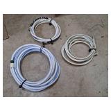 Three White and Blue Water Hoses