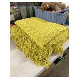 Two yellow throw blankets