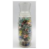 Decorative glass jar of marbles