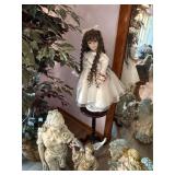Porcelain Doll with Plant Stand