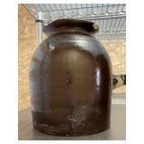 Brown Stoneware Jar with Chip