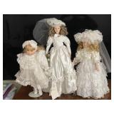 Three Porcelain Faced Dolls