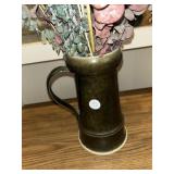 Brown pottery base with dried flowers